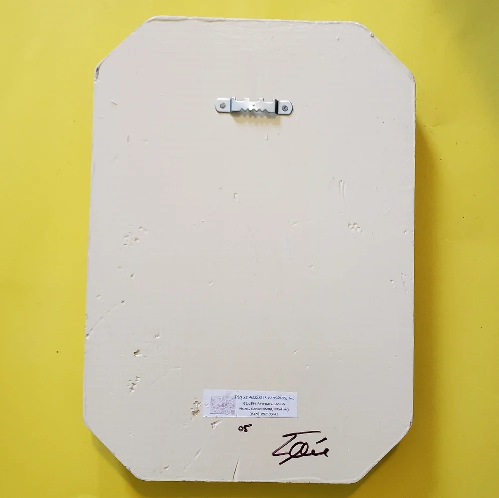 Genuine pique assiette mirror